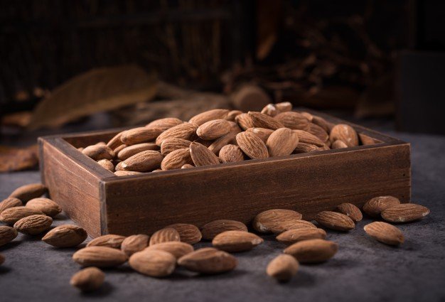 Wooden box filled with almond Mockup