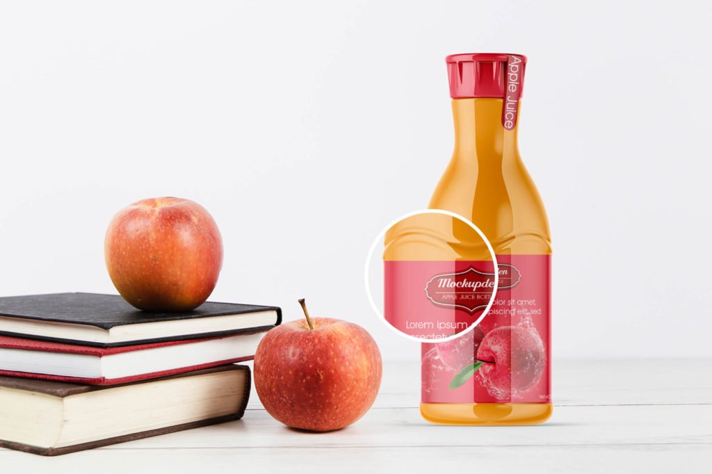 Closeup of a Free Apple Juice Bottle Mockup PSD Template