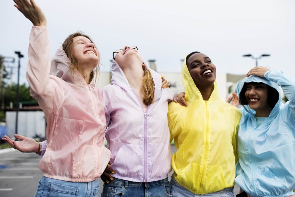 Girlfriends having fun in the rain