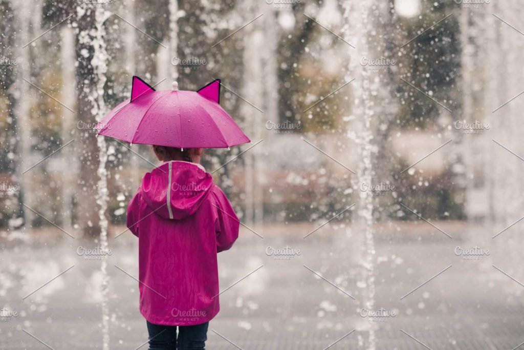 Kid girl with umbrella