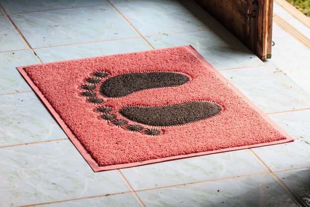 Foot on floor mat with Premium Photo (1)