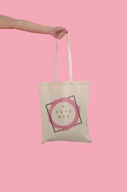 Hand holding tote bag Free Psd