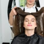 happy young woman with beautiful hair in hair salon (1)