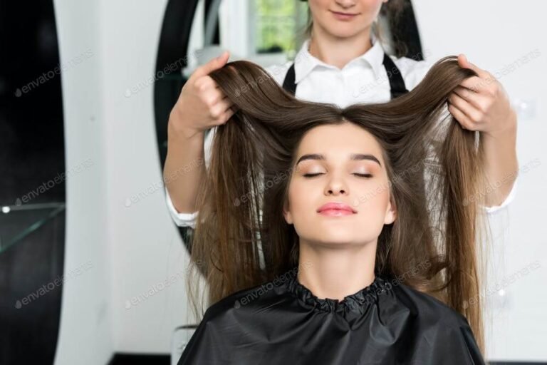 happy young woman with beautiful hair in hair salon (1)