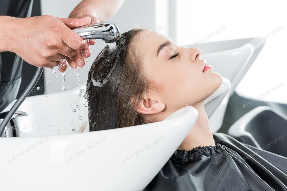 woman having hair wash in beauty salon (1)