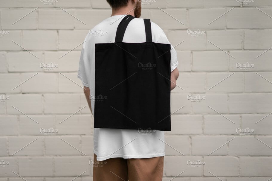 Man with black tote bag