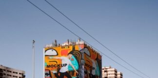Billboard mockup wrapped around building Free Psd