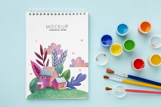 Notebook with watercolors and brushes Free Psd