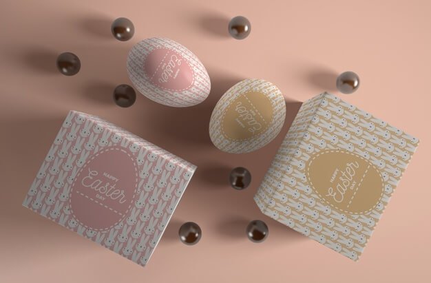 Boxes with eggs and chocolate candies beside Free Psd