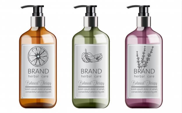 Bottles of organic shampoo with herbal care. various plants and colors. mint, orange and lavender Free Vector (1)