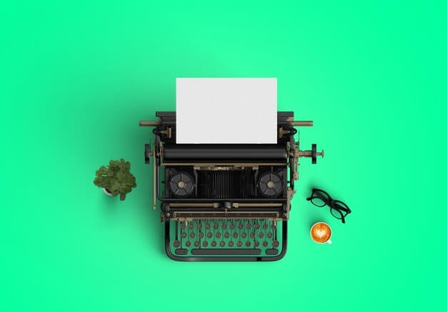Typewriter on green background Free Photo