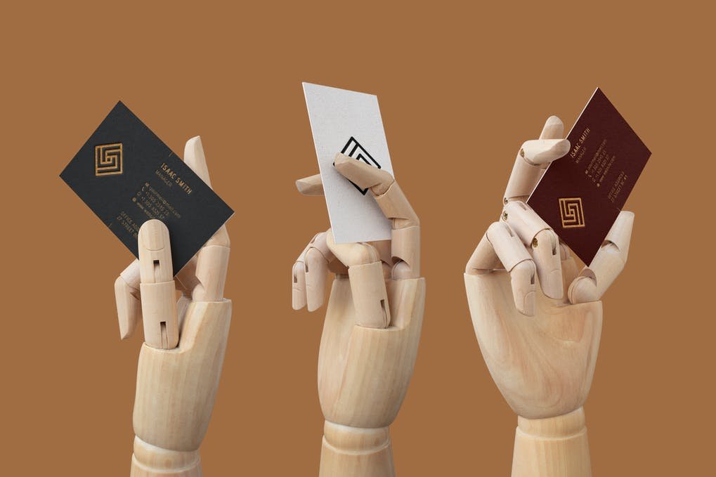 Business Card in Wood Hand Mockup