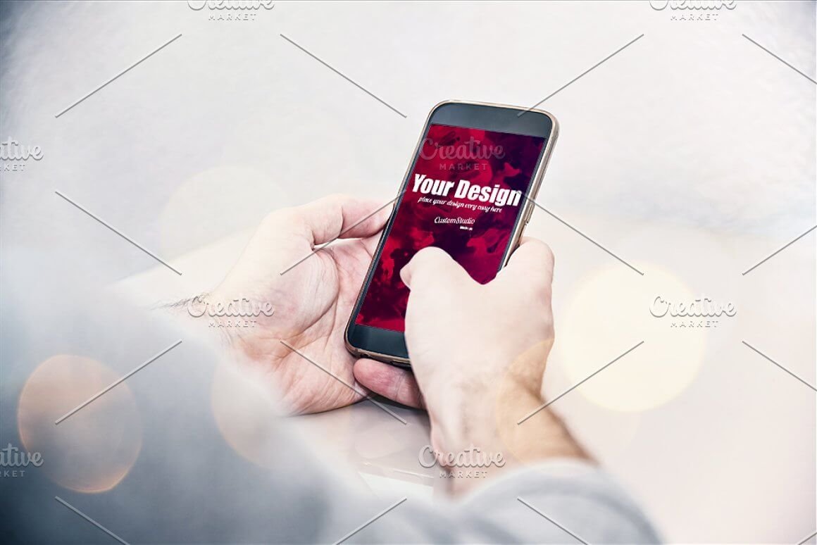 Smartphone in Man's hands PSD Mockup